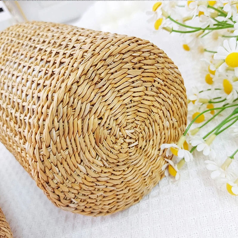 Handwoven wicker vase with a clear glass insert – close-up detail