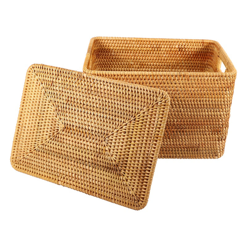 Large woven rattan trunk with side handles and a removable lid – close-up detail