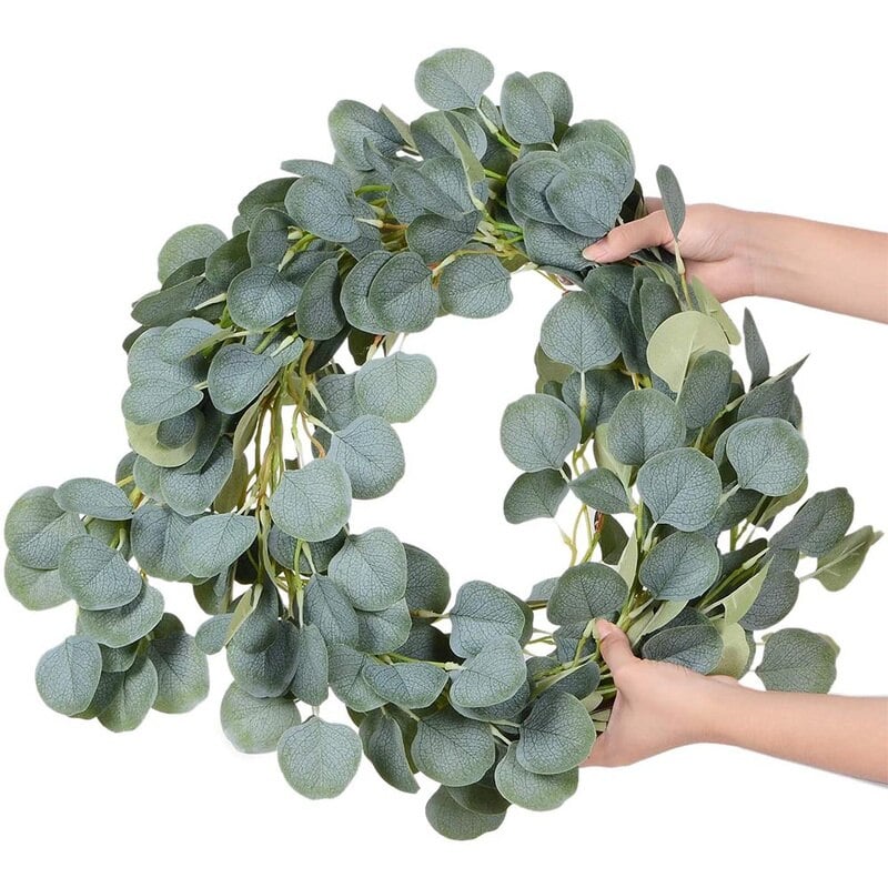 Artificial eucalyptus garland with small white flowers – shown in use