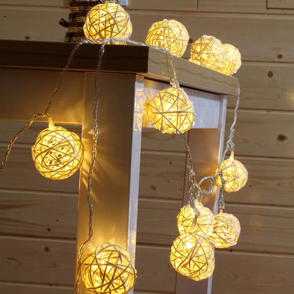 Rattan ring string lights with ten bulbs – shown lit in a room setting (2)