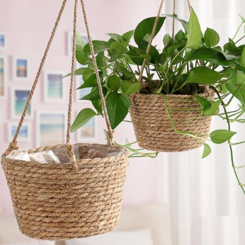 Natural jute macrame hanging planter – shown in a room setting