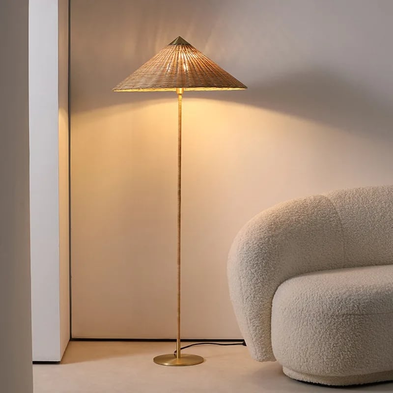 Minimalist wicker-look standing floor lamp with a slender silhouette – shown in a room setting