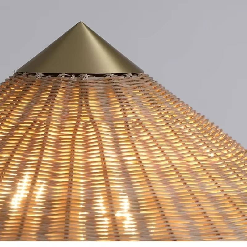 Pastoral rattan floor lamp with a large hat-shaped shade and golden base – close-up detail