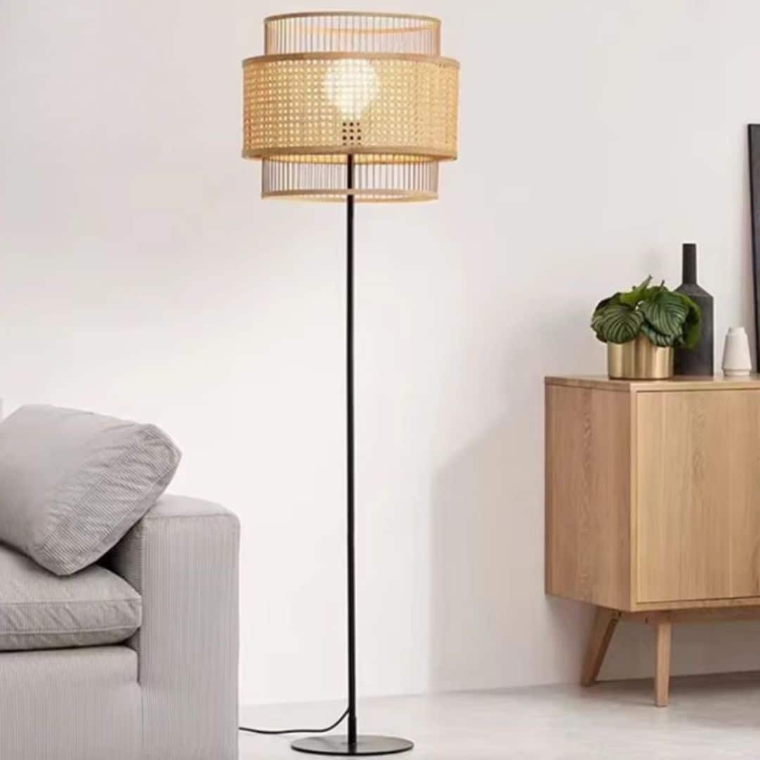 Vintage Japanese-style rattan floor lamp with a dark base – shown in a room setting