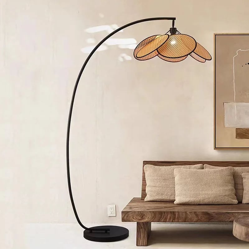 Rattan petal LED floor lamp with petals arranged in a crown – shown in a room setting