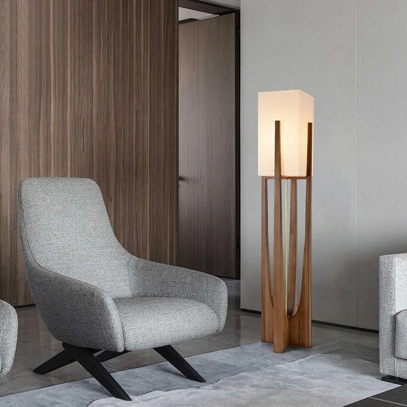 Modern wood table lamp with a handwoven shade – shown in a room setting