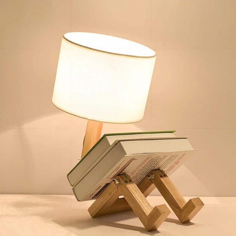 Hand-turned wooden robot table lamp – shown in a room setting