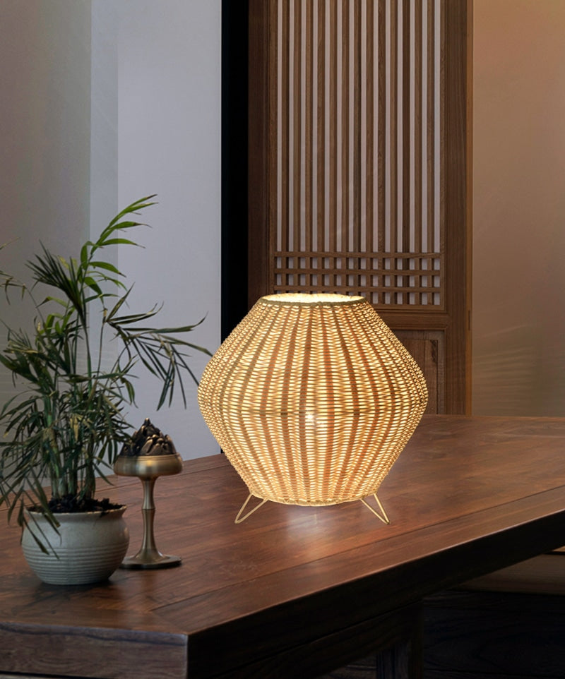 Handwoven tapered natural bamboo table lamp – shown in a room setting