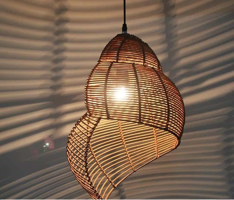 Brown handwoven rattan conch shell pendant light – close-up detail, lit