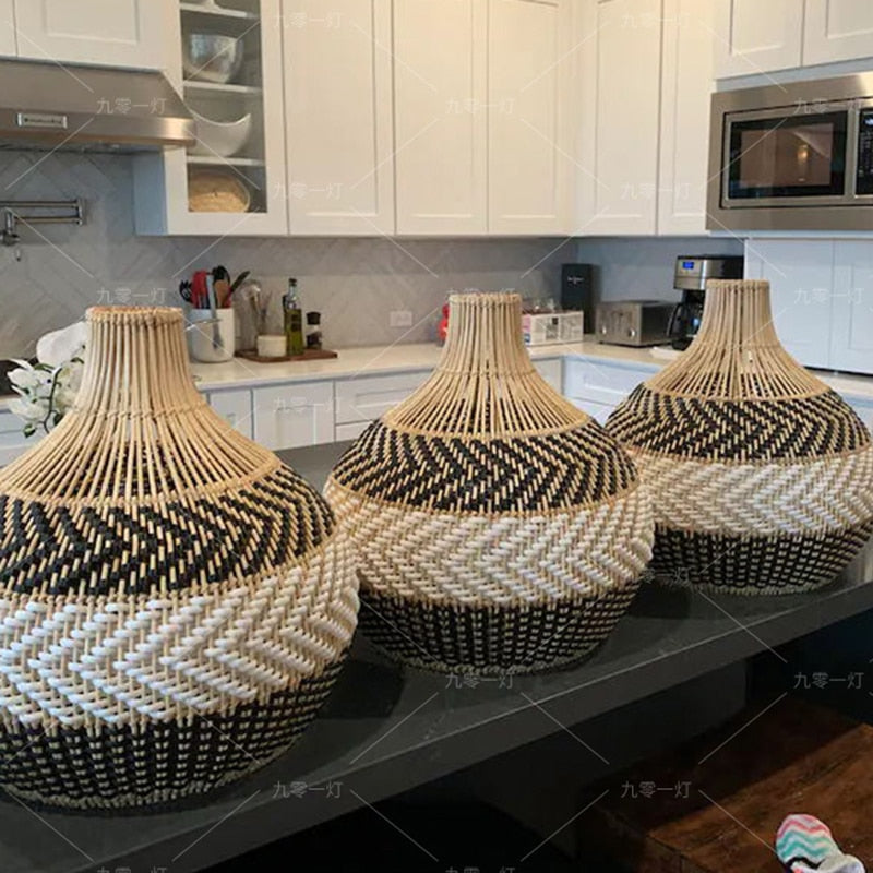 Chinese-style openwork handwoven rattan pendant light – shown in a room setting