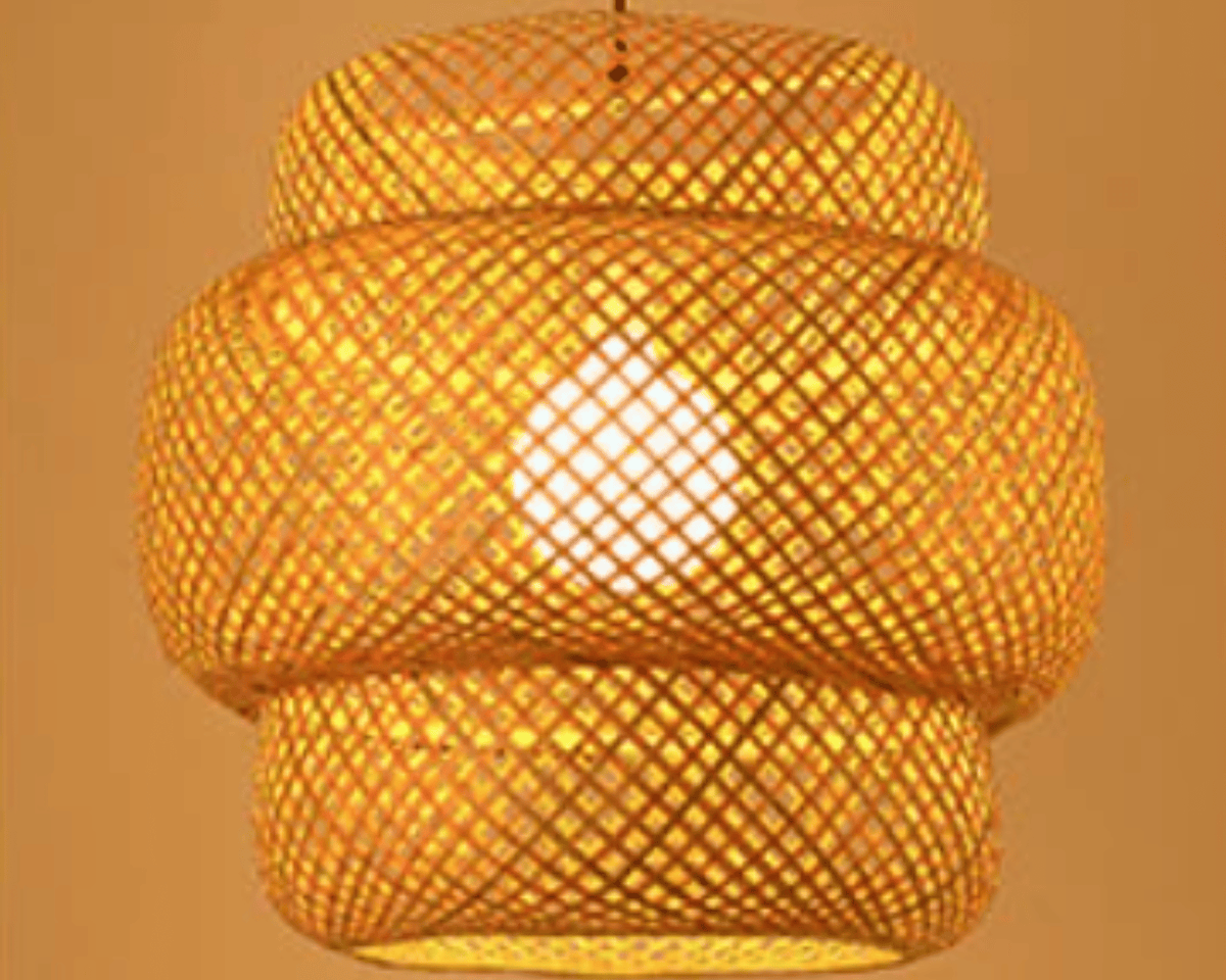Handwoven rattan sphere pendant light – shown lit