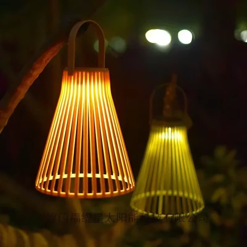 Colorful rattan-look aluminum solar lantern – shown lit outdoors