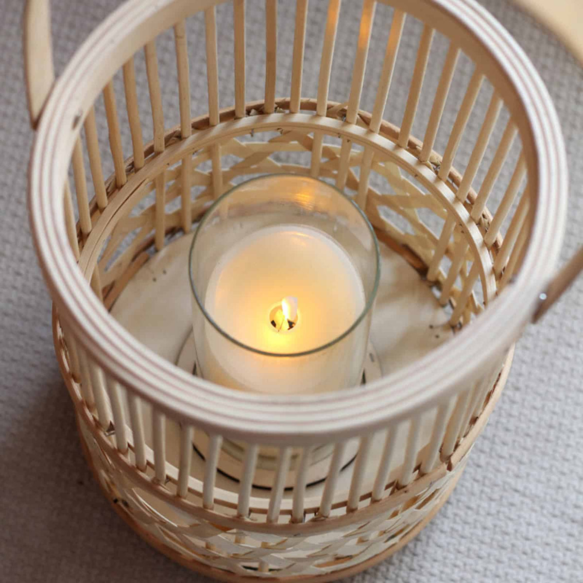 Hand-interlaced woven bamboo lantern – close-up detail, lit