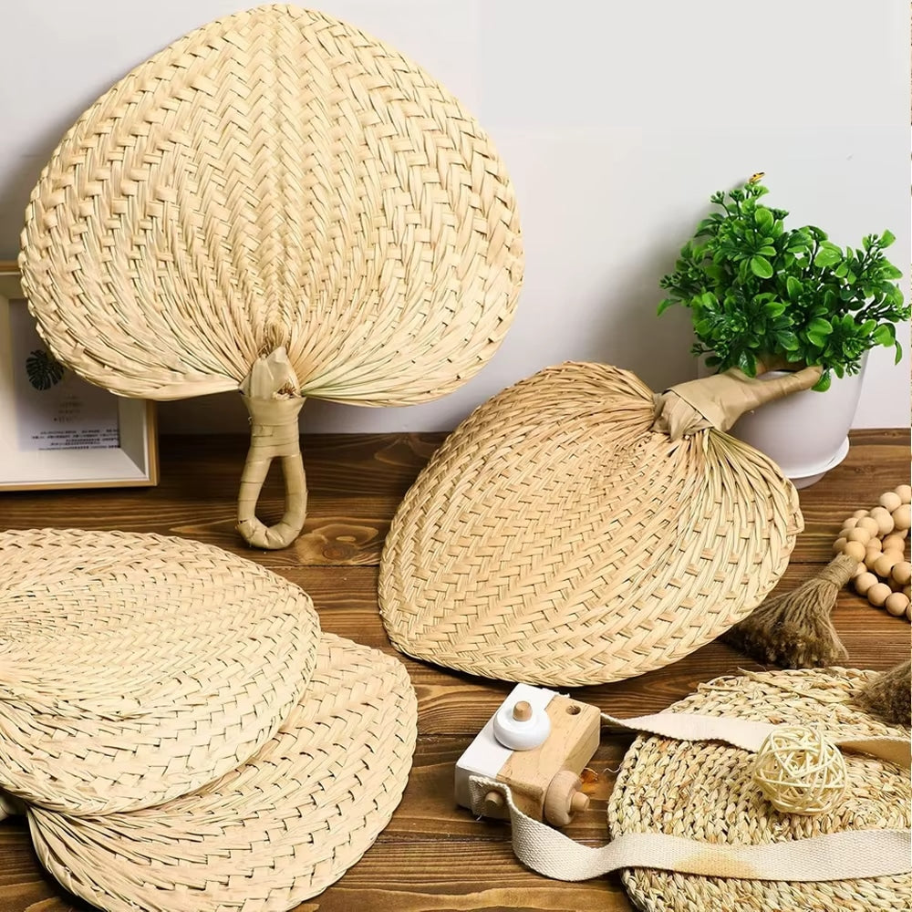 Set of ten heart-shaped rattan fans – shown in a room setting (2)
