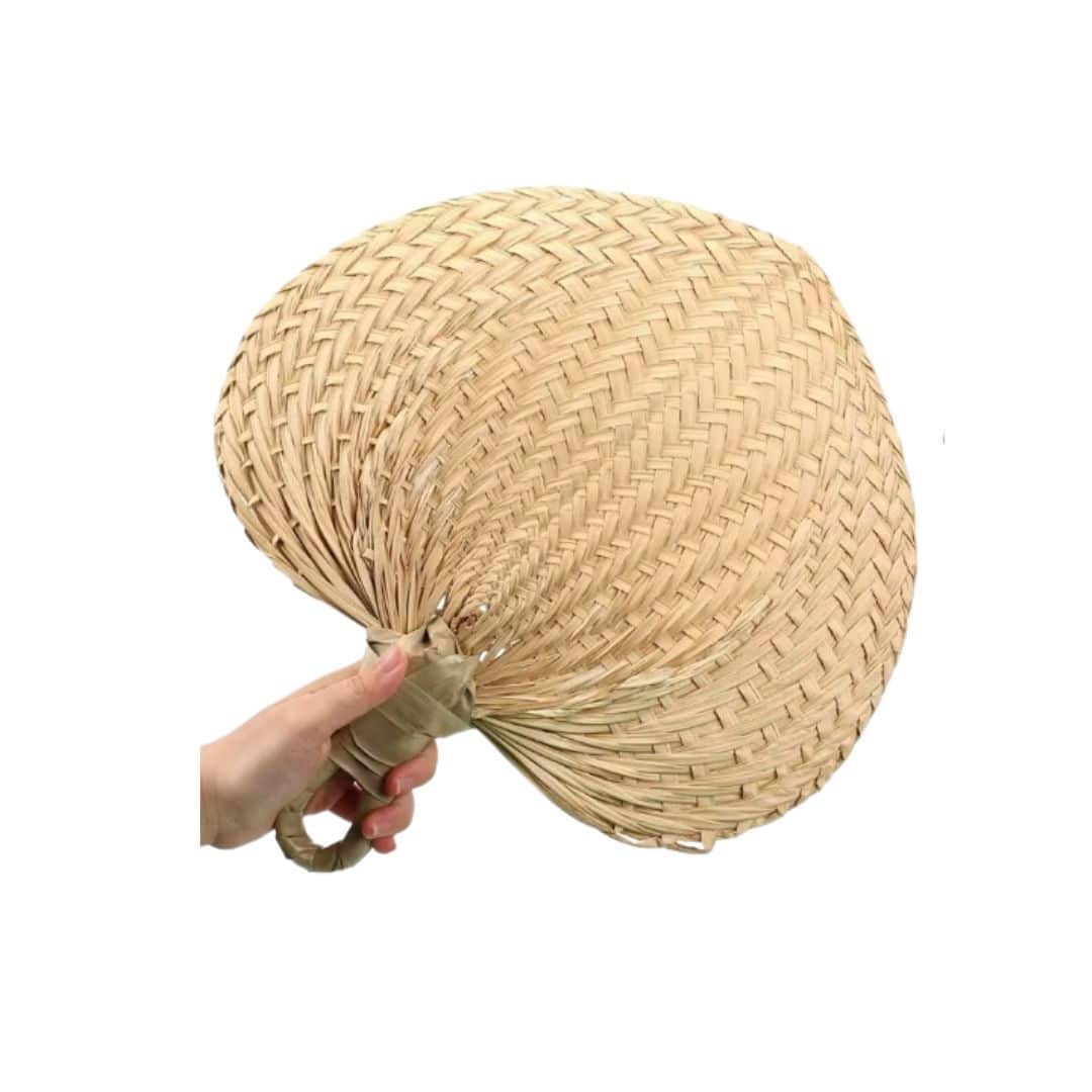 Set of ten heart-shaped rattan fans – shown in use