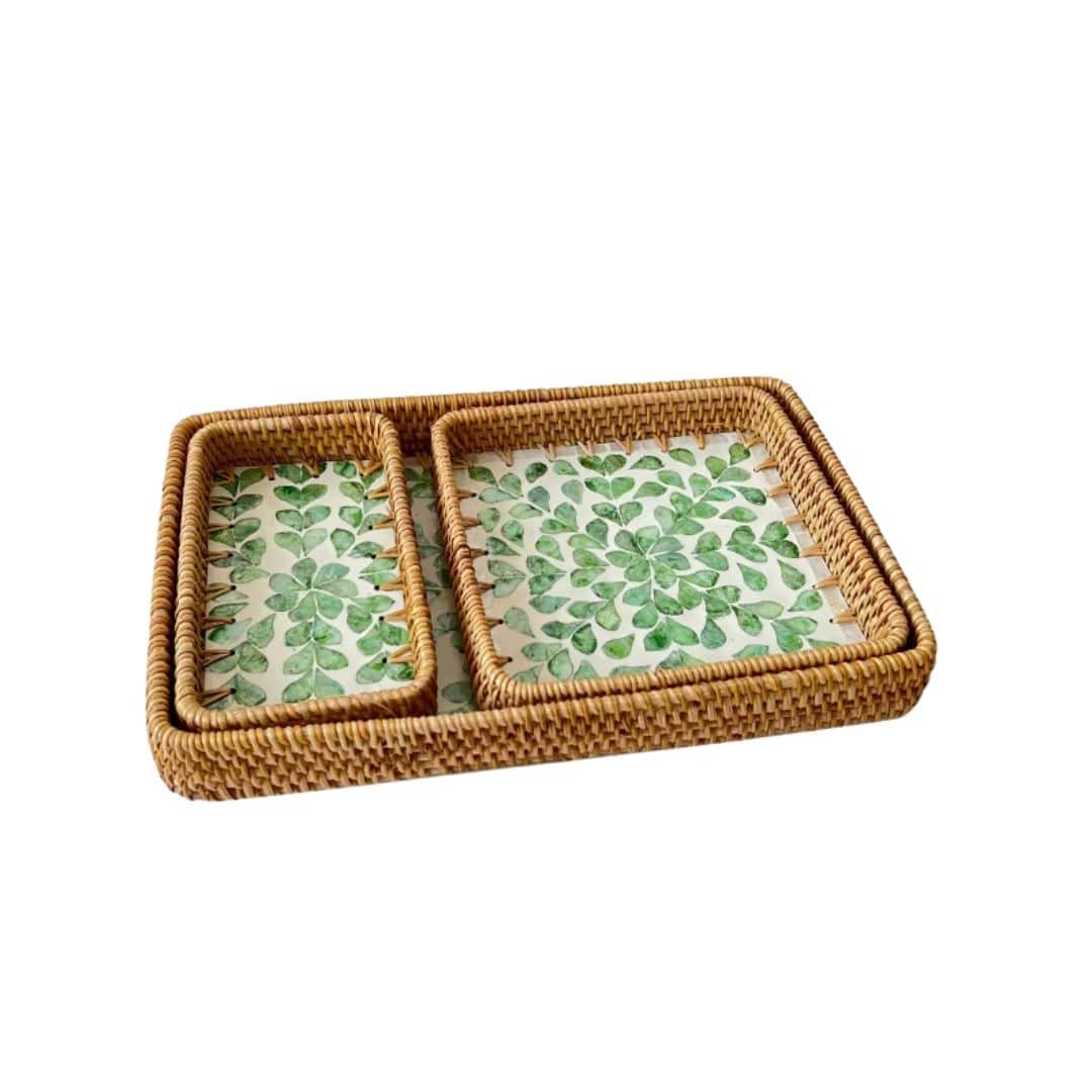 Set of three rattan trays with woven leaf motifs