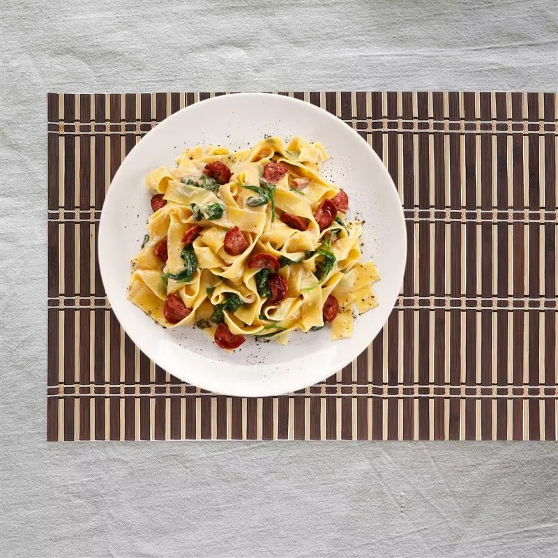 Set of four foldable bamboo slat placemats – shown in a room setting