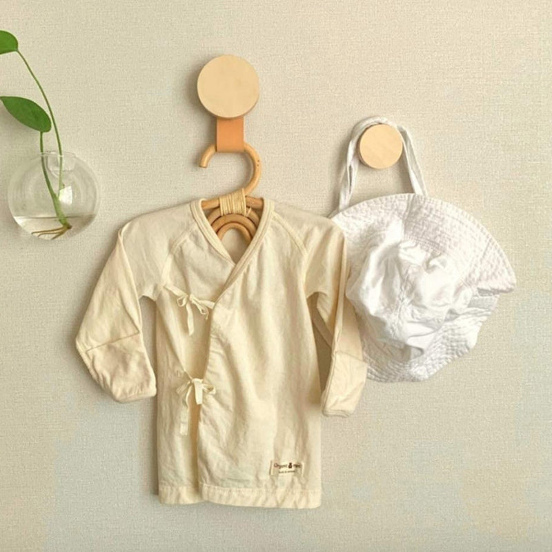 Set of three moon, sun and rainbow rattan kids hangers – shown in a room setting