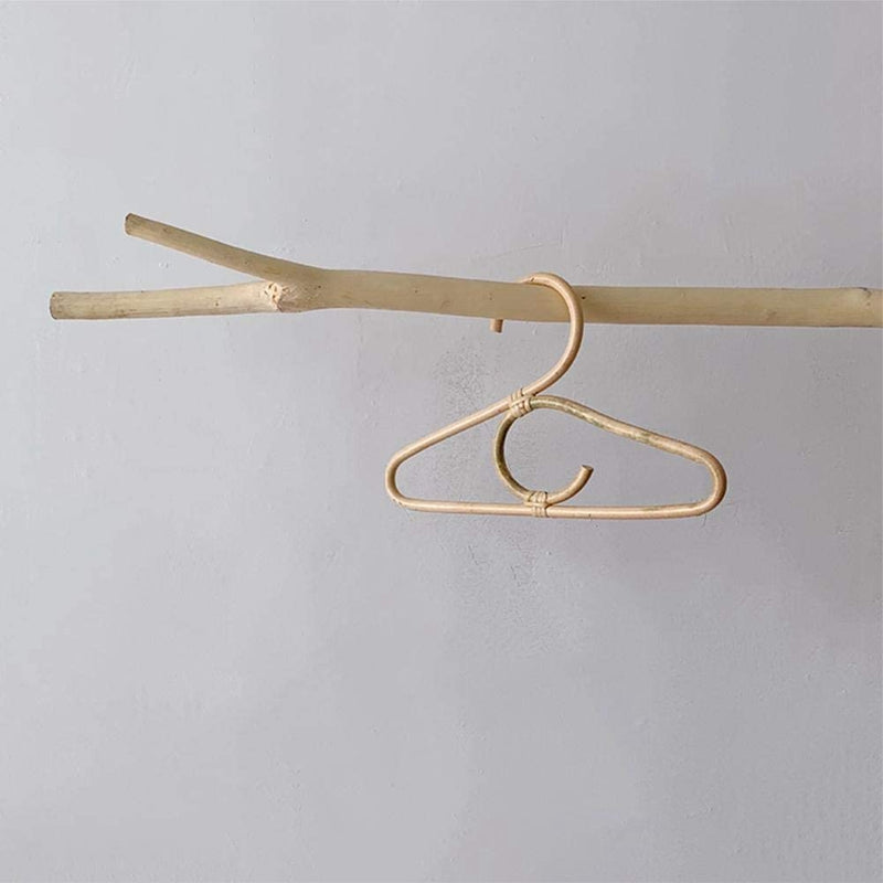 Set of three simple rattan kids hangers – shown in a room setting