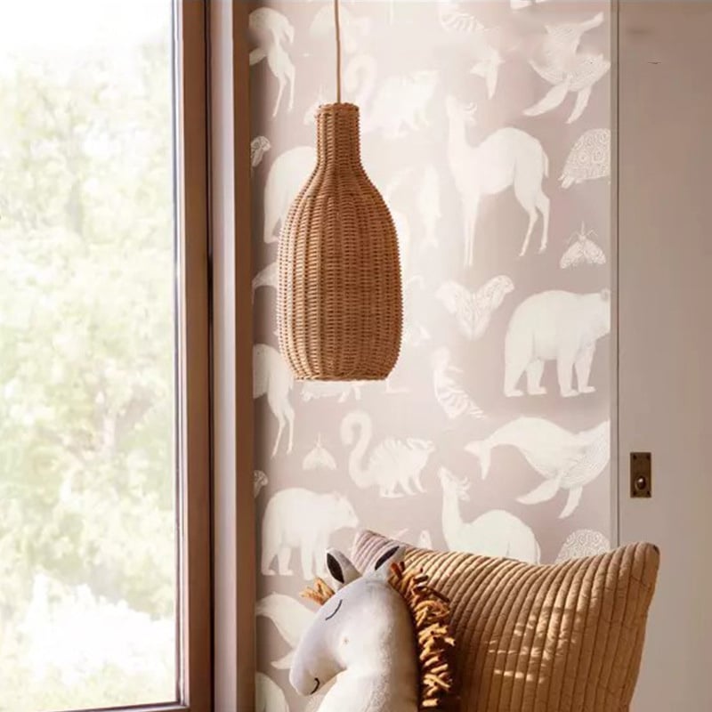 Chinese village-style handwoven oval rattan and wicker pendant light – shown in a room setting (2)