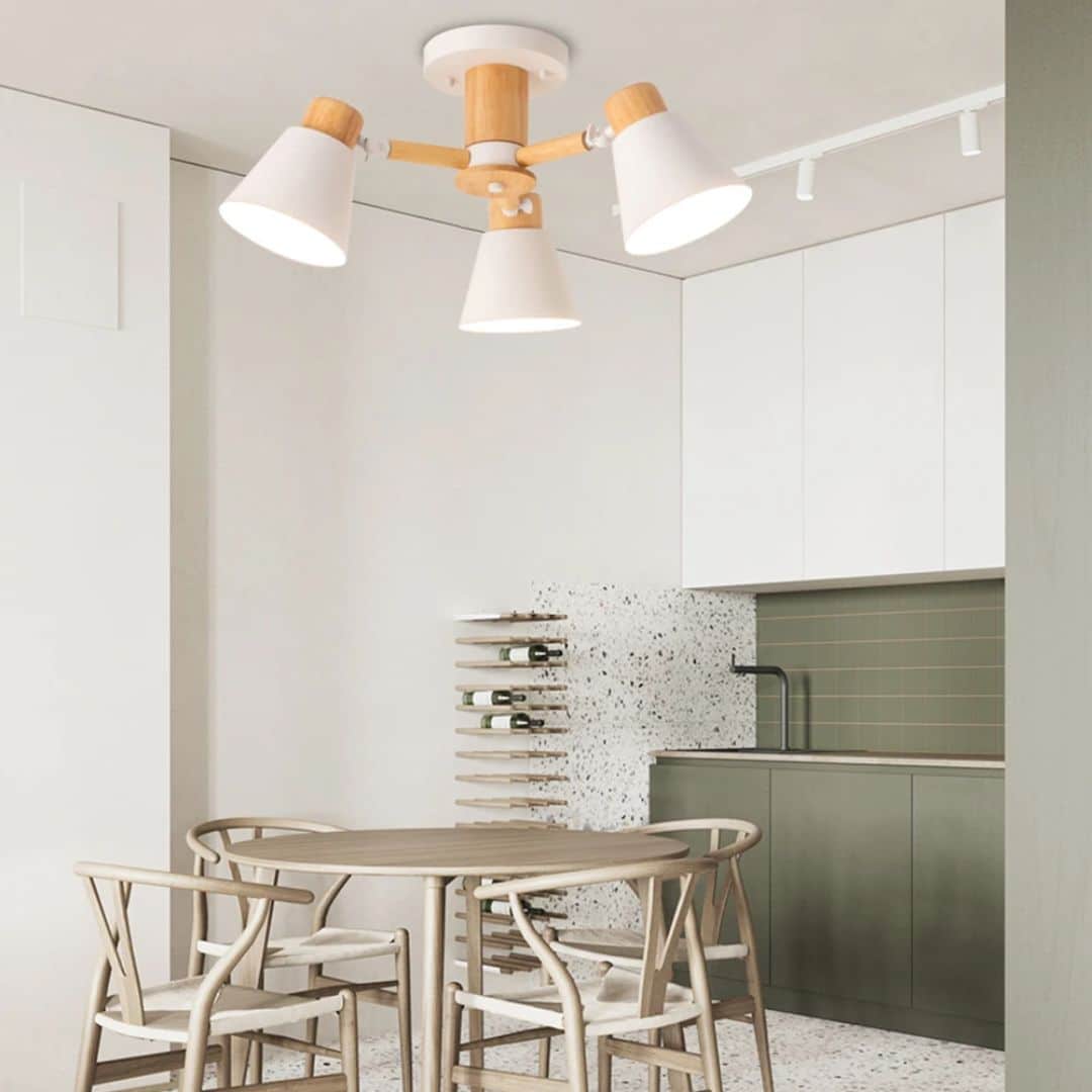 Modern three-arm LED chandelier with natural wood arms – shown in a room setting