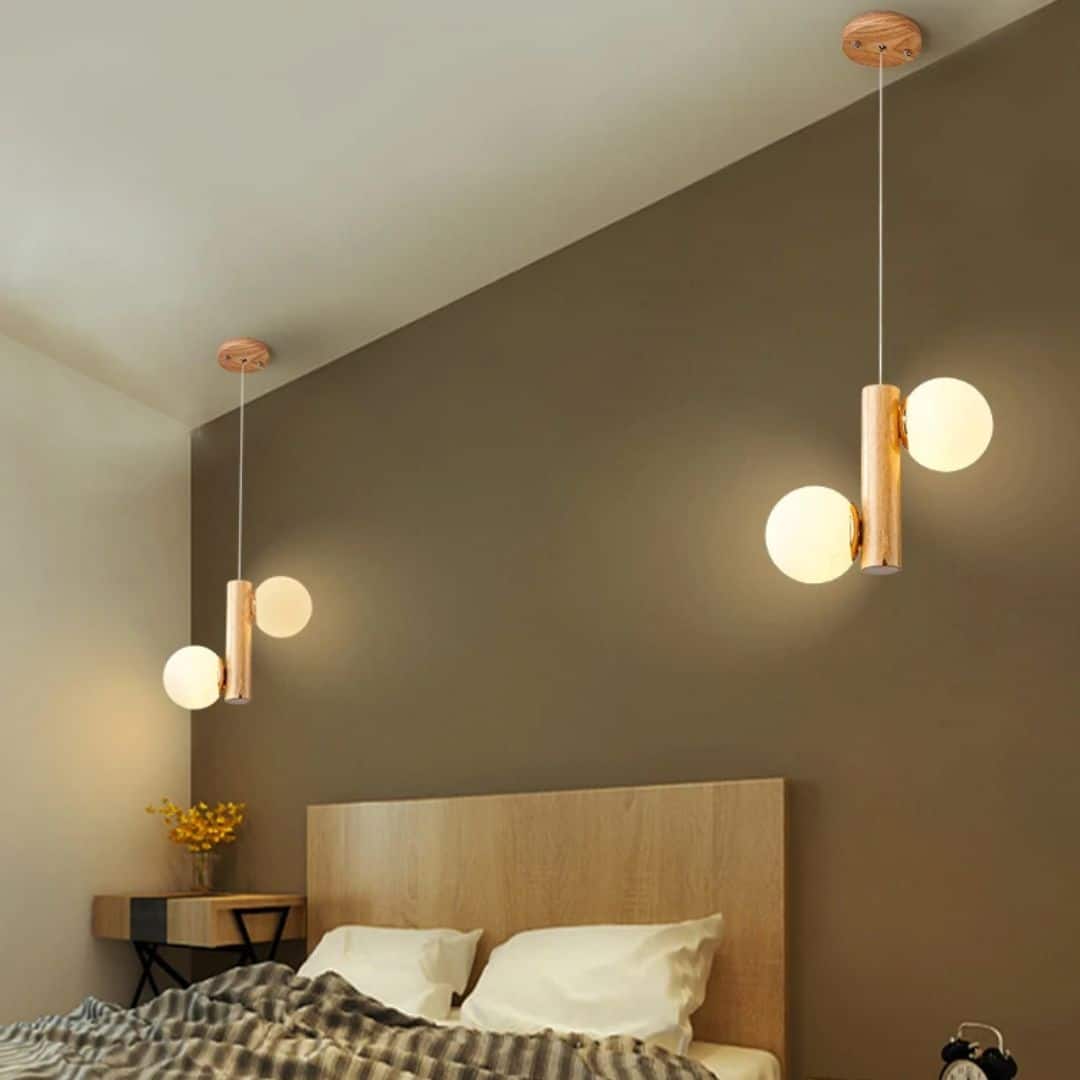 Two-globe frosted glass and wood LED chandelier – shown in a room setting