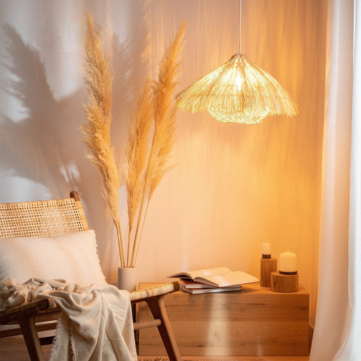 Round yellow bamboo and wood chandelier with an open circular structure – shown lit in a room setting (2)