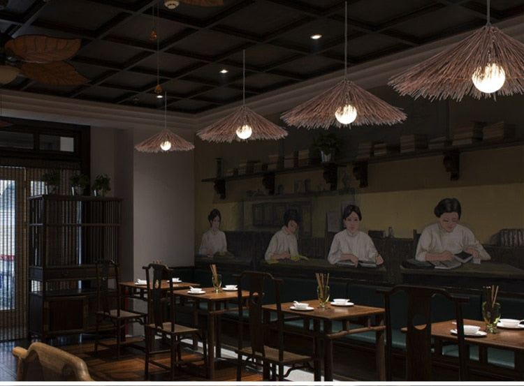 Round brown bamboo and wood chandelier with a tight weave – shown in a room setting