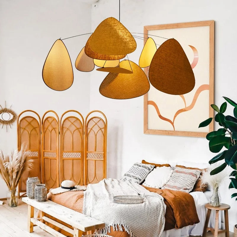 Floating fabric petal chandelier with layered petals – shown in a room setting