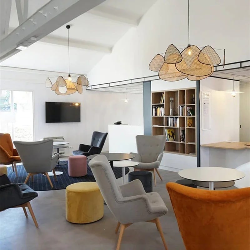 Modern geometric chandelier in rattan with woven bamboo slats – shown in a room setting (3)