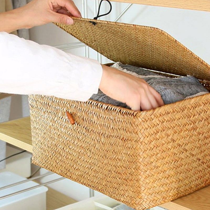 Natural rattan storage trunk with tightly braided sides – shown in use