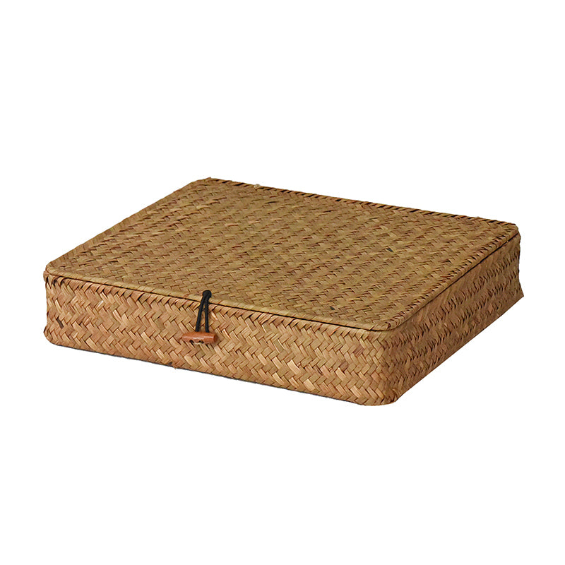 Low flat storage trunk in light natural rattan
