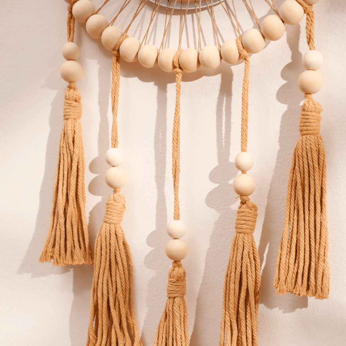 Wooden mirror with macramé fringe and hanging beads – close-up detail (2)