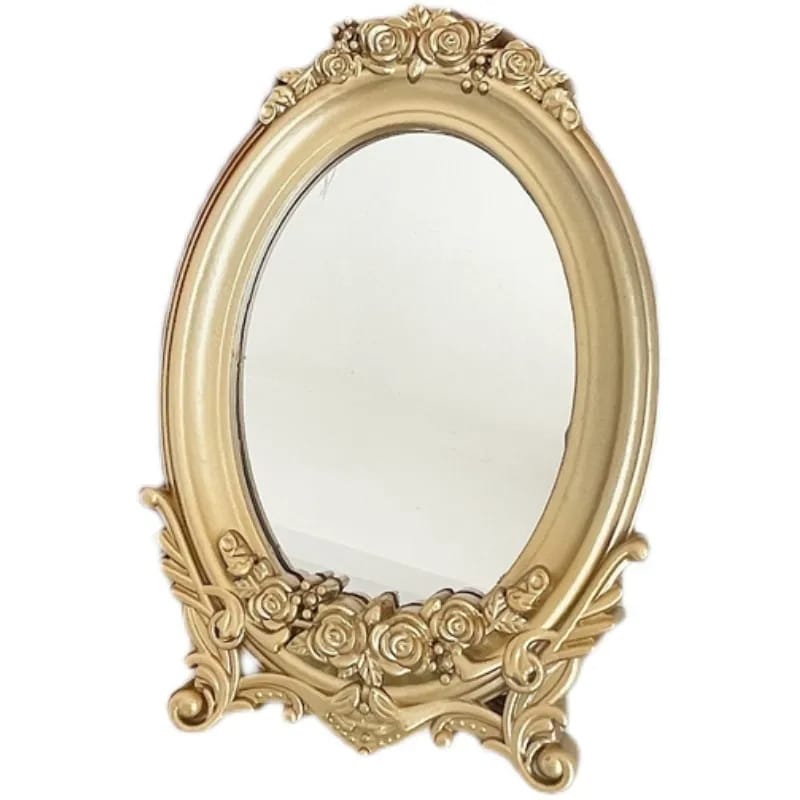 Oval wood-look mirror framed by gold molding