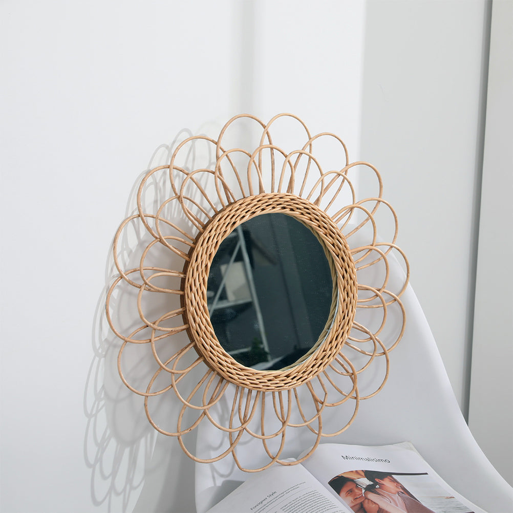Large flower-shaped mirror with radiating natural rattan petals – shown in a room setting (3)