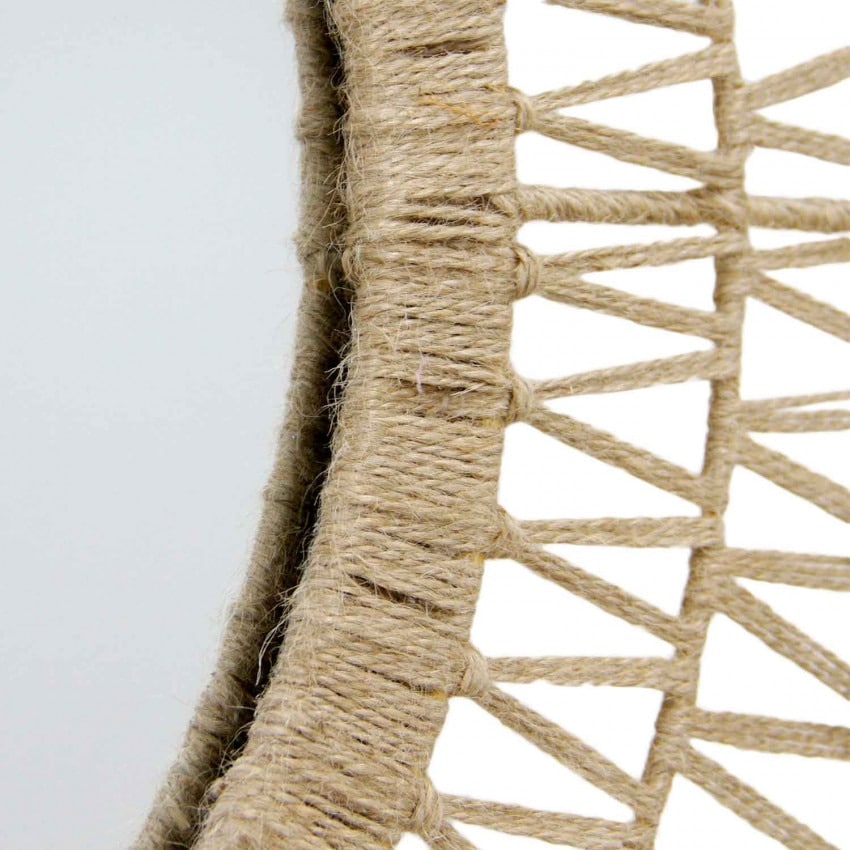 Natural rattan wall mirror with a tightly braided untreated frame – close-up detail
