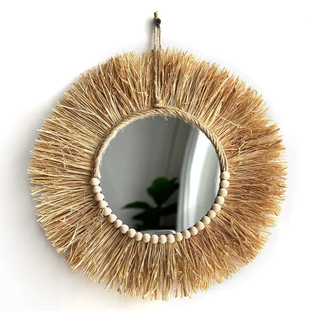 Boho round straw mirror with warm golden highlights