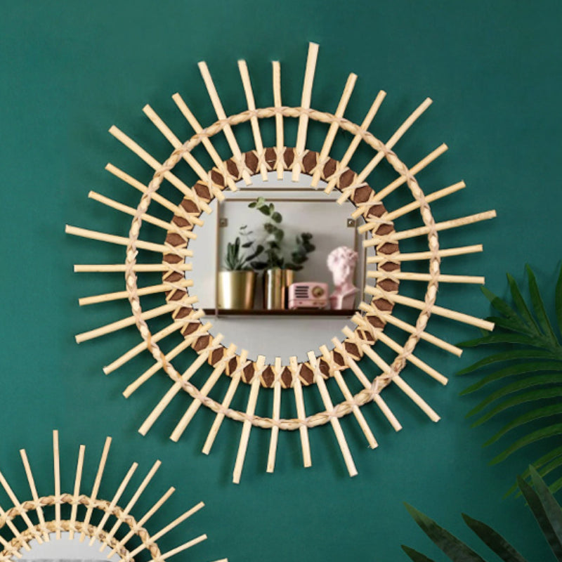 Large beige rattan sun mirror with a crown of braided rays – shown in a room setting