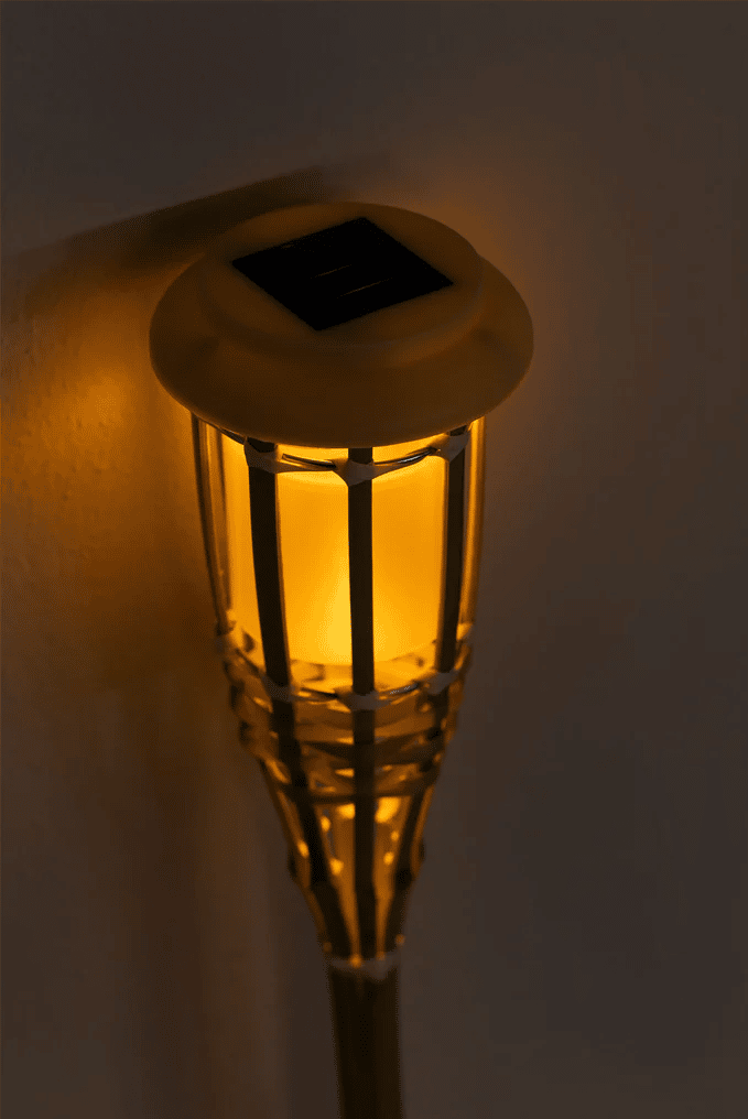 Set of 12 natural color rattan solar lanterns – close-up detail, lit