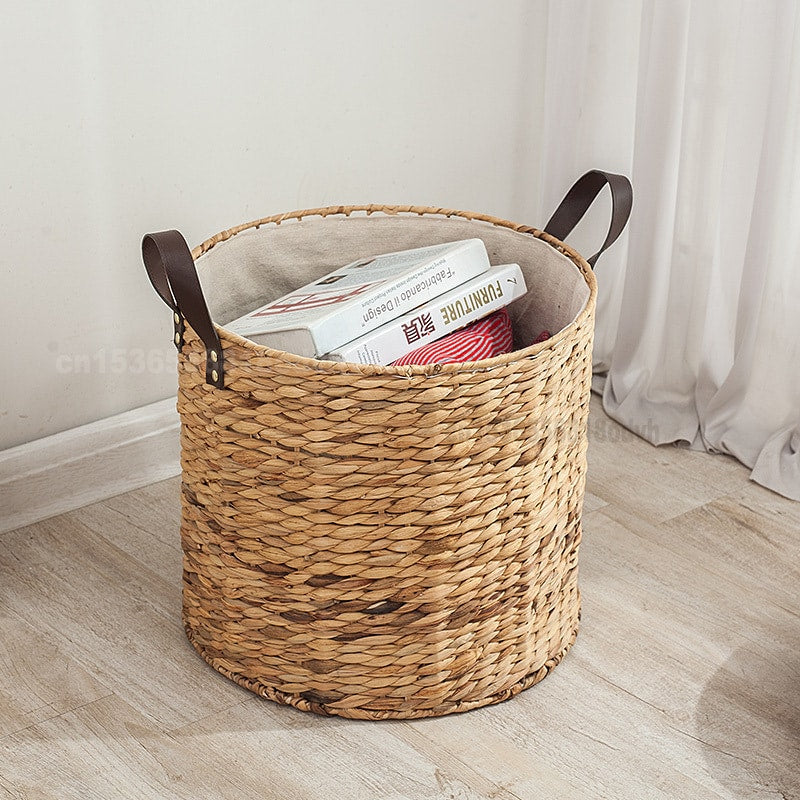 Rattan laundry basket with two handles woven into its structure – shown in a room setting (2)