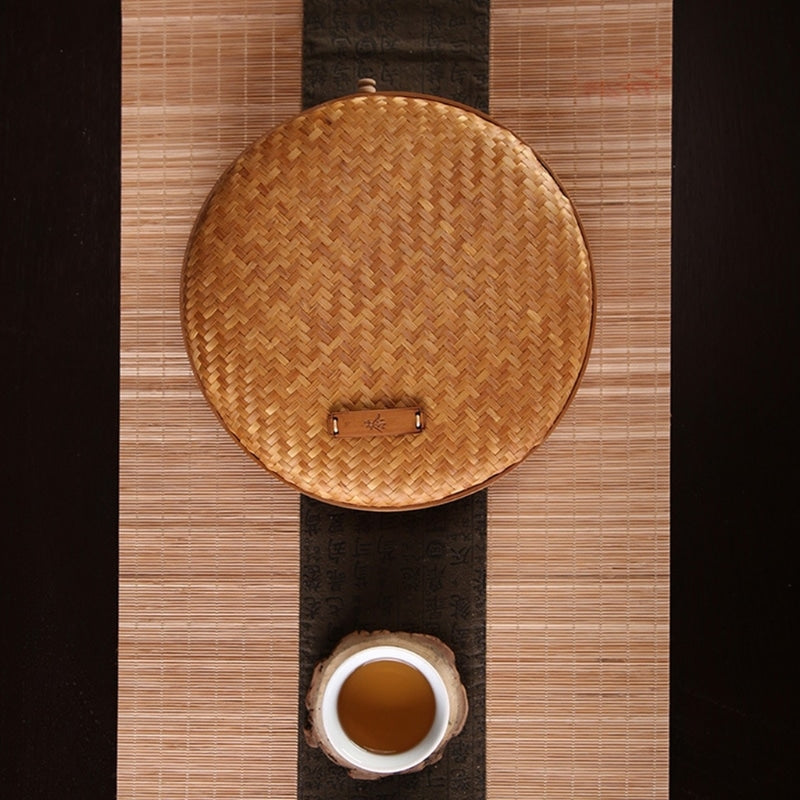 Handmade rattan tea storage basket with a lid – shown in a room setting (2)