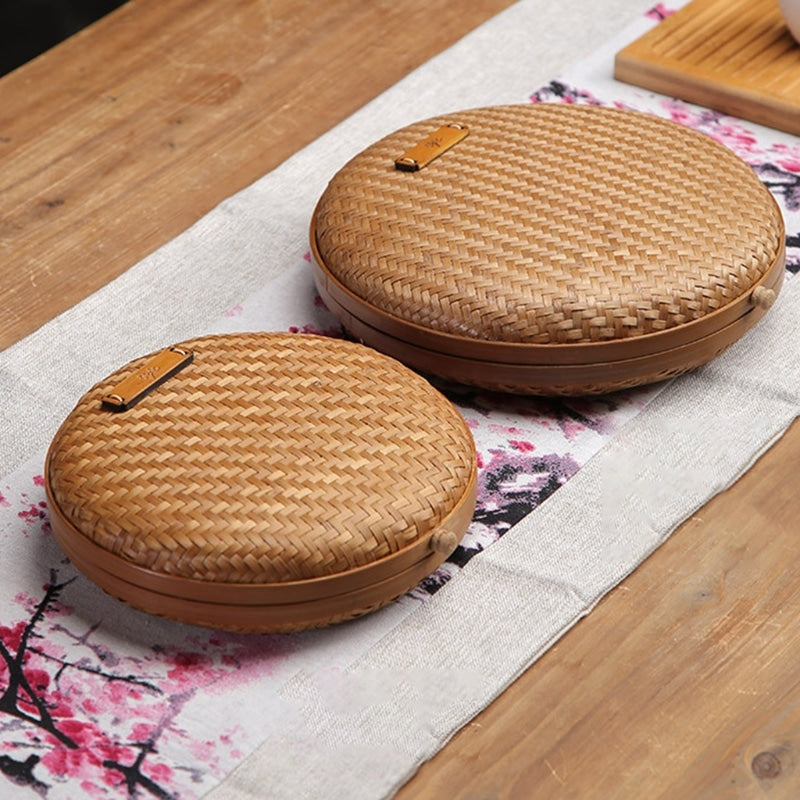 Handmade rattan tea storage basket with a lid – shown in a room setting