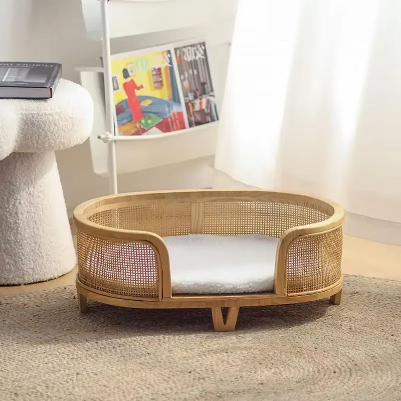 Handwoven wicker dog bed raised on tapered legs