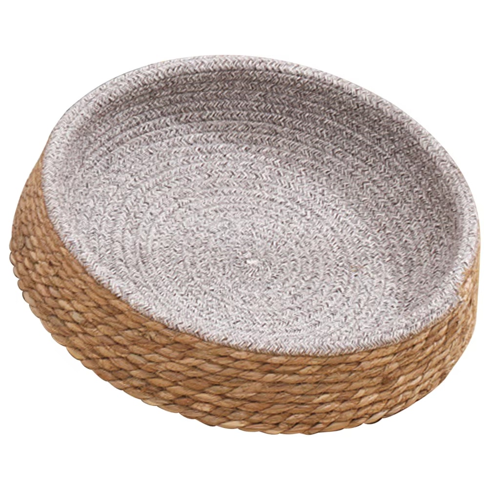 Round handwoven wicker dog bed with gray and beige padding – close-up detail
