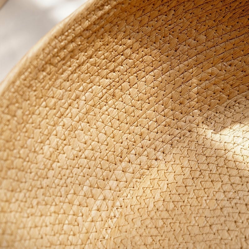Raised handwoven natural rattan dog bed – close-up detail
