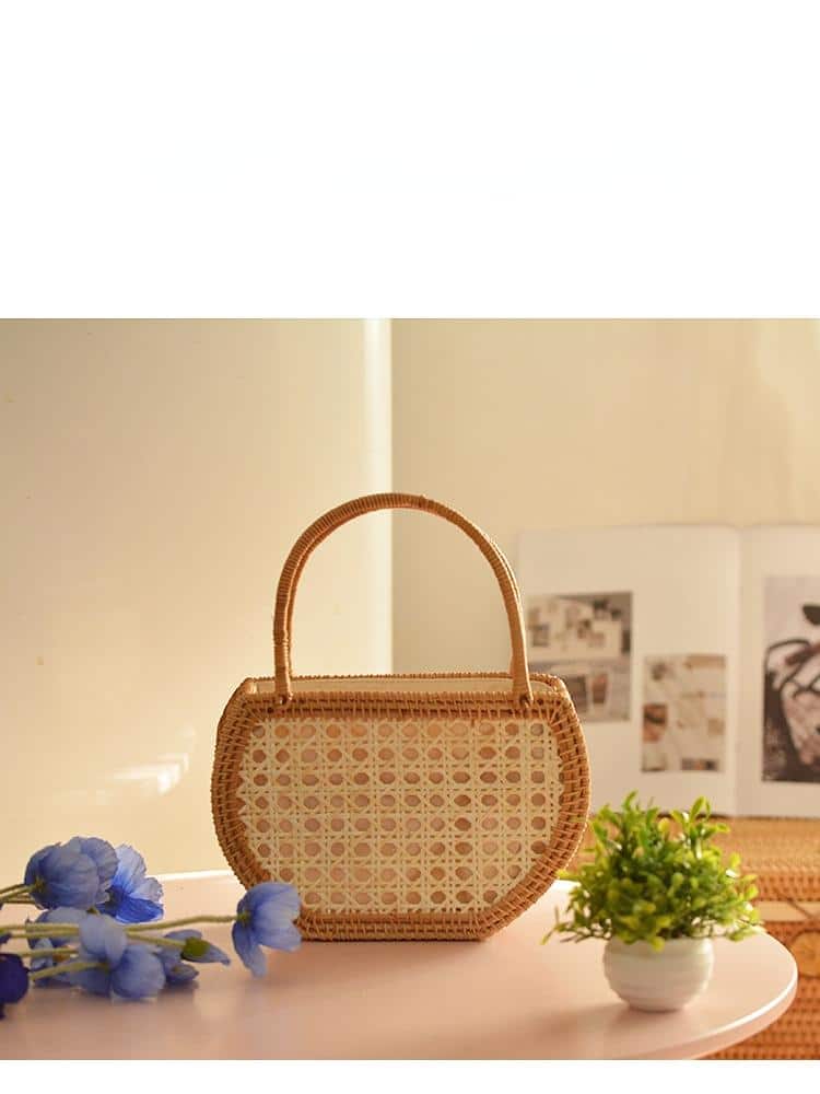 Handmade pure rattan picnic basket with a white cotton lining – shown in a room setting