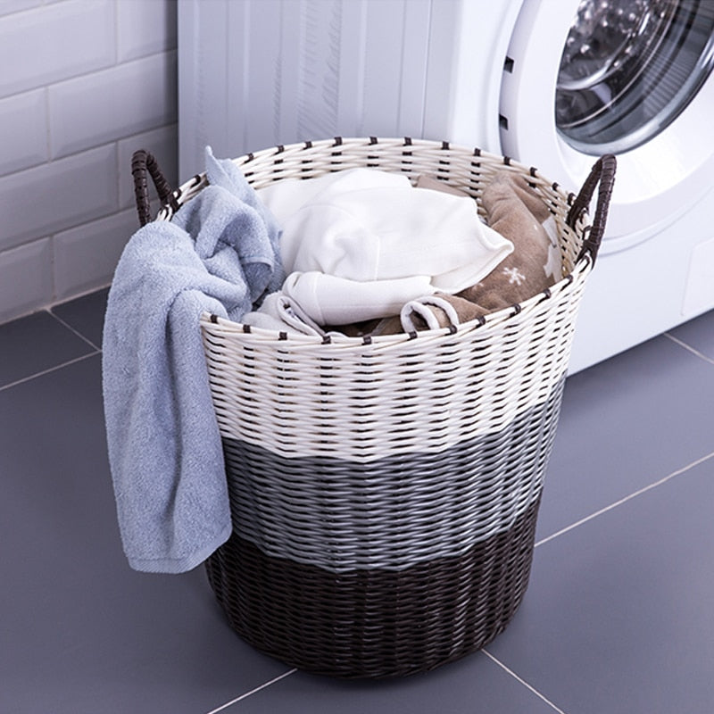 Foldable woven rattan laundry basket – shown in a room setting