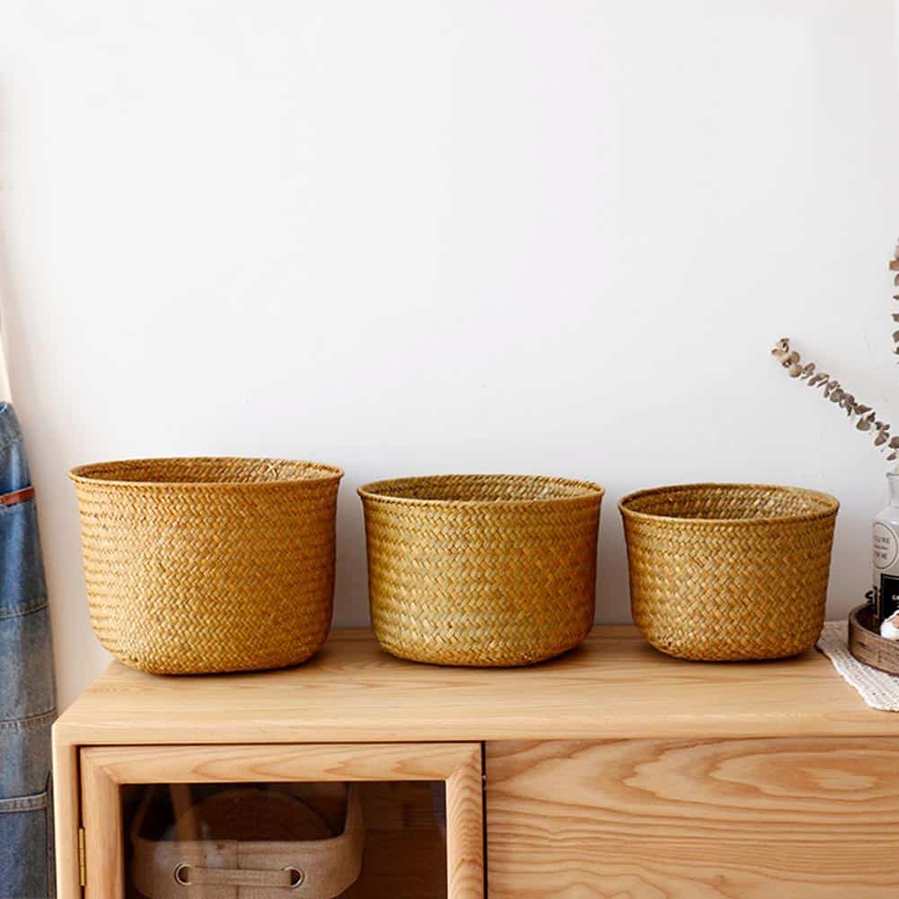 Handwoven rattan storage basket with crossed strands – shown in a room setting