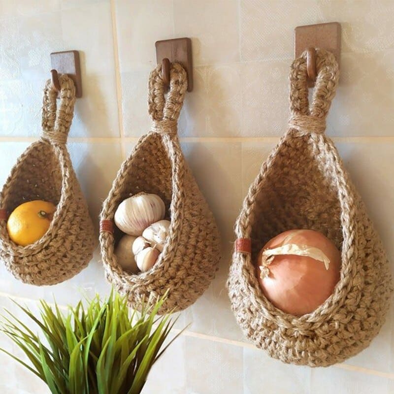Wall-hanging woven fruit and vegetable basket with open walls – shown in a room setting (2)