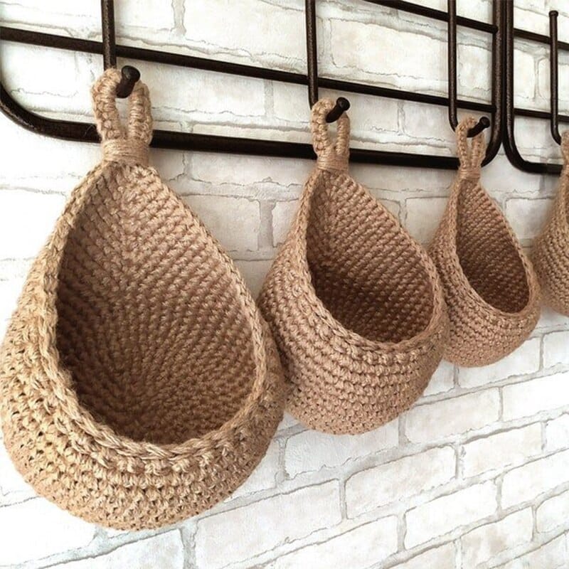 Wall-hanging woven fruit and vegetable basket with open walls – shown in a room setting